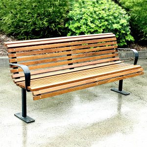 Curved timber seat for parks and recreational areas